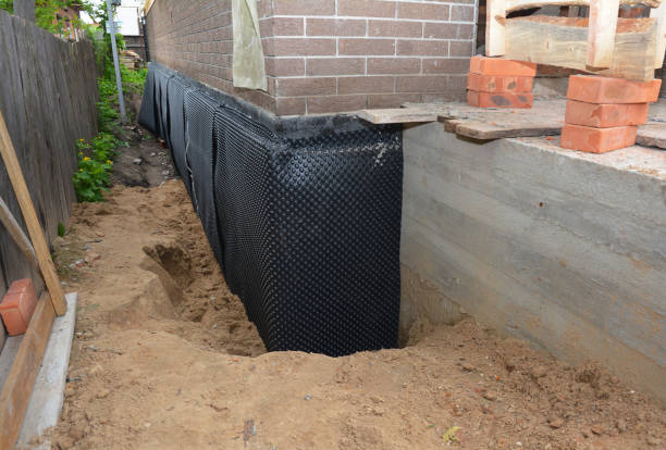 SJ Waterproofing Pros technician performing targeted Waterproofing assessment in Middleport, NY